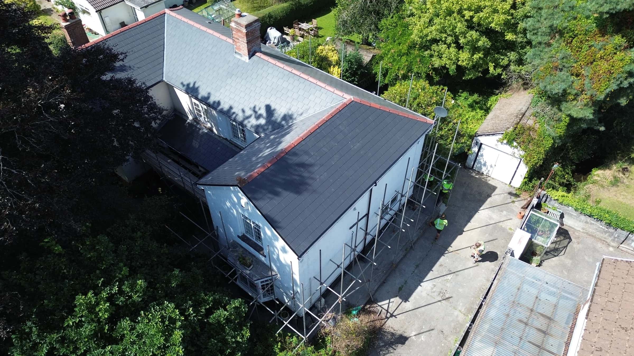 Completed slate roof on a detached house, aerial view, South Wales